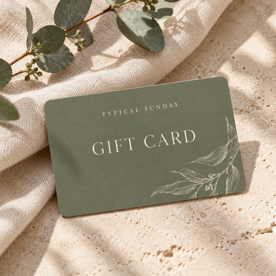 Typical Sunday digital gift card in sage green, photographed on linen with eucalyptus