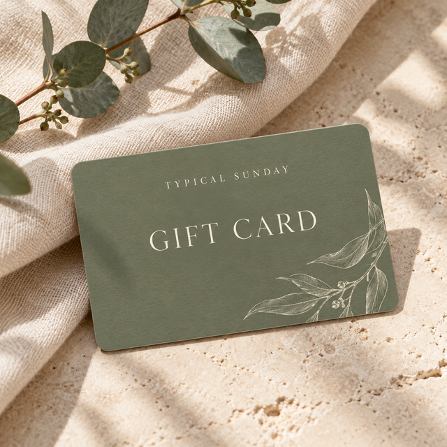 Typical Sunday digital gift card in sage green, photographed on linen with eucalyptus